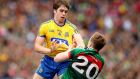 Roscommon’s David Murray and Mayo’s Donal Vaughan get to know each other. Photograph: Ryan Byrne/Inpho