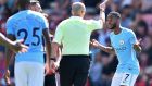 Manchester City’s  Raheem Sterling reacts after being sent off by referee  Mike Dean after  receiving  a second yellow card for going into the crowd to celebrating his injury-time goal against Bournemouth. Photograph:  Glyn Kirk/AFP/Getty Images