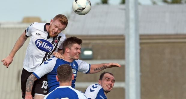 Dundalk’s Seán Hoare gets above  Conor Murphy of Crumlin United during the  FAI Cup second-round match at the  Iveagh Grounds. Photograph: Ciarán Culligan/Inpho