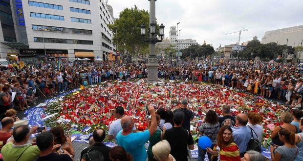 People place placards and candles in honour of  victims of the Barcelona and Cambrils terror attacks on the Las Ramblas boulevard in Barcelona on August 26th, during a march against terrorism. Photograph: Lluis Gene/AFP/Getty Images