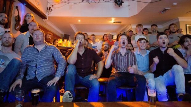 Fans watch the live coverage of the Conor McGregor V Floyd Mayweather boxing match from Las Vegas in a Dublin city pub. Photograph: Tom Honan