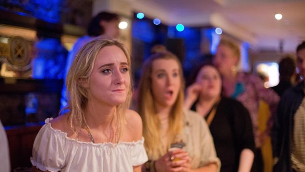 Aoibhinn Moore from Tipperary watching the final round of the Conor McGregor vs Floyd Mayweather boxing match in a Dublin city pub. Photograph: Tom Honan.