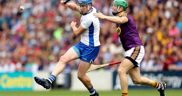 Gleeson flicks it past Matthew O’Hanlon of Wexford during their All-Ireland quarter-final. Photo: James Crombie/Inpho