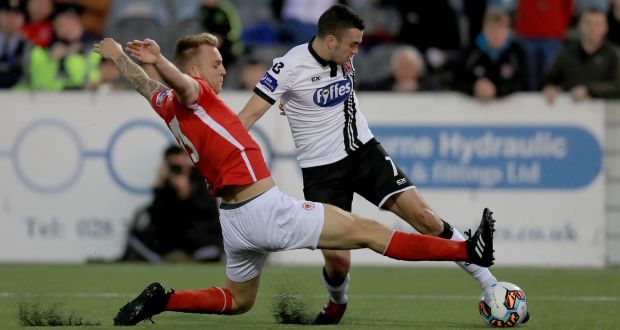 Jordi Balk of St Patrick’s  Athletic slides in to tackle Dundalk’s Michael Duffy during the SSE Airtricity League Premier Division match  at Oriel Park. Photograph: Donall Farmer/Inpho