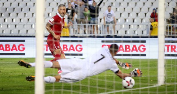 Serbia’s Aleksandar Kolarov scores their second goal in the Group D match against Moldova in Belgrade. Photograph: Marko Djurica/Reuters