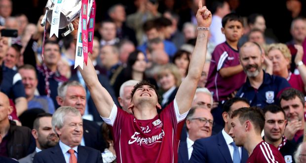 Galway’s Jason Flynn  celebrates with the Liam McCarthy Cup. Photograph: James Crombie/Inpho