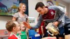All-Ireland champions: Galway captain David Burke with Martin Cummins at Our Lady’s Children’s Hospital, in Crumlin. Photograph: Bryan Keane/Inpho