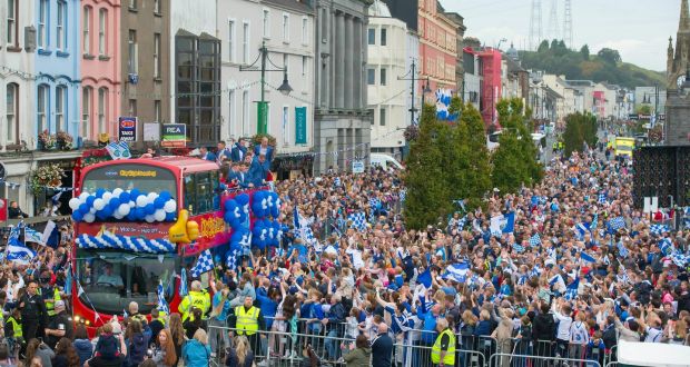  Waterford hurlers on board an open-topped bus are greeted by thousands of fans in the city on Monday evening. Photograph:  Patrick Browne 
