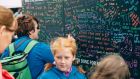 People writing on the #SoundEffect ‘Wall of Sound’ at Electric Picnic 2017
