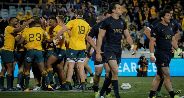 The Australia team celebrate a try against Argentina. Photograph: Jason Reed/Reuters
