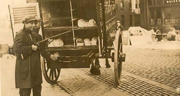 A bread cart with armed fighters in the Irish Civil War, around 1922: We can never know for sure if Protestants were targeted out of pure religious hatred or selected as convenient symbols of the old coloniser, Britain. Photograph: National Library of Ireland
