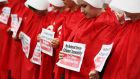 Members of ROSA (Reproductive rights, against Oppression, Sexism & Austerity) outside Leinster House dressed as “handmaids”, characters from the TV series The Handmaid’s Tale in which women are treated by men as property in a future United States. Photograph: Brian Lawless/PA Wire
