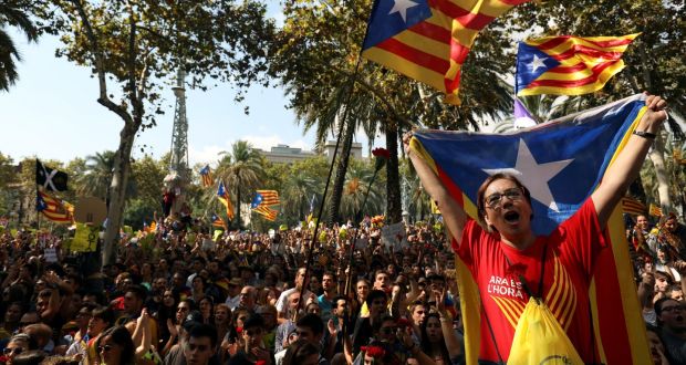 Protesters shout slogans and wave Catalan separatist flags outside the high court in Barcelona. Photograph: Susana Vera/Reuters