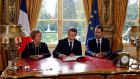 French president Emmanuel Macron signs documents to promulgate a new labour bill at the Elysee Palace in Paris. Photograph: Philippe Wojazer/AFP/Getty Images
