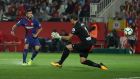  Luis Suarez scores Barcelona’s  third goal against Girona  in the 3-0 victory at the Estadi Montilivi. Photograph: Albert Gea/Reuters