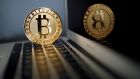 A Bitcoin (virtual currency) coin is seen in an illustration picture taken at La Maison du Bitcoin in Paris. Photograph: Benoit Tessier/Reuters