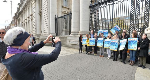 Bríd Smith TD takes a picture of the members of the Oireachtas employees for choice gathered outside the Department of the Taoiseach. Photograph: Alan Betson 