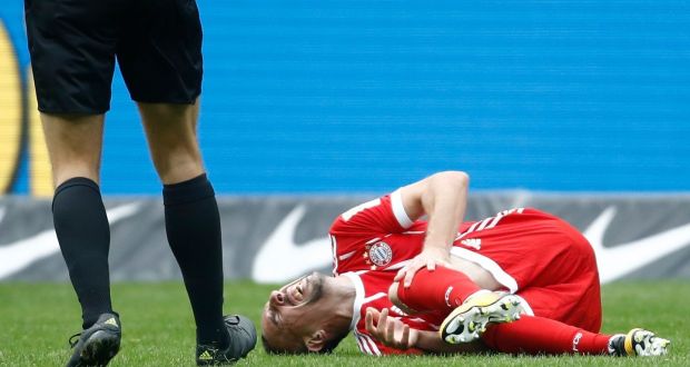 Bayern Munich’s Franck Ribery goes down injured during their clash with Hertha Berlin. Photo: Odd Andersen/Getty Images