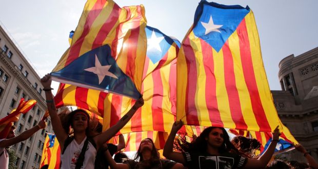 Catalan separatists wave flags in Barcelona. Photograph: Enrique Calvo/Reuters