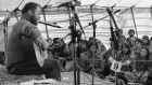  Christy Moore entertains some of the protesters at an Anti-Nuclear protest at Carnsore Point, Co Wexford, in August 1978. Photograph: Eddie Kelly 