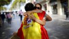 A man wearing a Spanish flag gives “free hugs” in central Barcelona, Spain. Photograph: Ivan Alvarado/Reuters