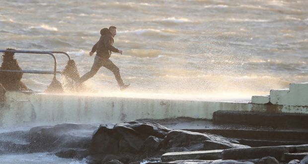 People at the  diving board in Salthill, Galway as Hurricane Ophelia hit on Monday. Photograph: Niall Carson/PA