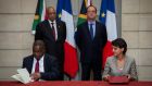 South Africa’s then education minister Blade Nzimande signs an agreement in Paris alongside his French counterpart, Najat Vallaud-Belkacem, while presidents Jacob Zuma and François Hollande look on, in July 2016. Photograph: Jeremy Lempin/Reuters