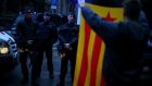 A demonstrator holds up an Estelada (Catalan separatist flag) during a gathering in Barcelona. Photograph: Ivan Alvarado/Reuters