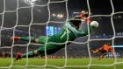 Claudio Bravo of Manchester City saves a penalty at the Etihad Stadium. Photograph:  Gareth Copley/Getty Images