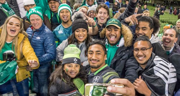   Bundee Aki takes a picture with his   daughter Adrianna Aki and family members after the match. Photograph: Morgan Treacy/Inpho