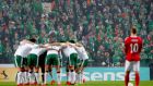 Ireland players during their pre-match huddle ahead of the first leg of their 2018 World Cup qualifying playoff in Copenhagen. Photo: James Crombie/Inpho