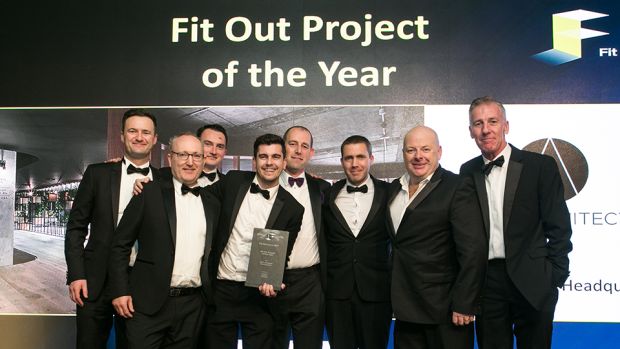 Cathal McGuinness, Director, SAS International presents the Fit Out Project of the Year award to the ODOS Architects team