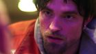 Robert Pattinson in Good Time: his hair is yellowed to the colour of diseased liver, his eyes suspiciously unblinking