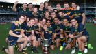 The Australian team pose with the Cormac McAnallen trophy after winning game two and the seriesagainst  Ireland at Domain Stadium  in Perth, Australia. Photograph: Paul Kane/Getty Images
