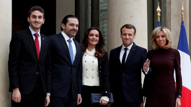 French president Emmanuel Macron and his wife Brigitte, Lebanon’s Saad al-Hariri, his wife Lara and their son Houssam at the Élyseé Palace in Paris. Photograph: Benoit Tessier/Reuters