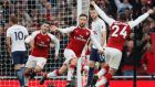 Arsenal’s Shkodran Mustafi celebrates scoring his team’s first goal against Tottenham on Saturday. Phoograph: Reuters