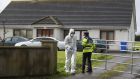 Garda at the scene in Edenderry, Co Offaly, where a man was stabbed to death. Photograph: Niall Carson/PA