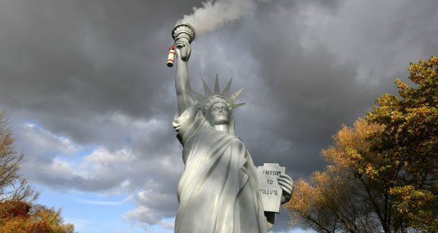 A replica of the Statue of Liberty by Danish artist Jens Galschiot emits smoke in a park outside the 23rd UN Conference of the Parties (COP) climate talks in Bonn. Photograph: Martin Meissner/AP