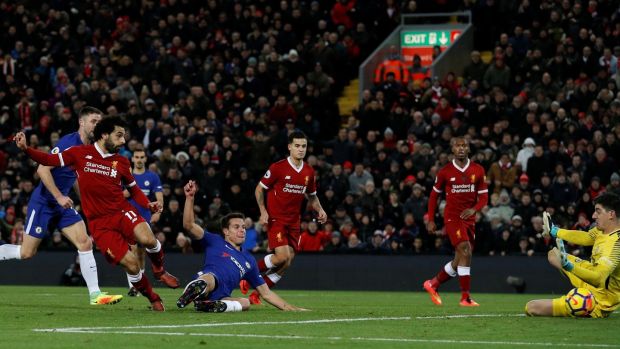 Liverpool’s Mohamed Salah scores against Chelsea. Photograph: Phil Noble/Reuters