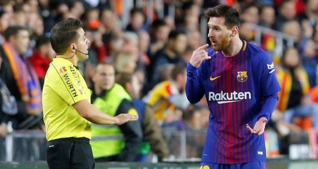 Barcelona’s Lionel Messi remonstrates with the assistant referee. Photograph:  Heino Kalis/Reuters