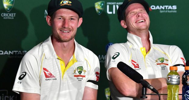 Australia’s captain Steve Smith reacts as team mate Cameron Bancroft speaks after their sides resoundign win over England. Photograph: Darren England/AAP