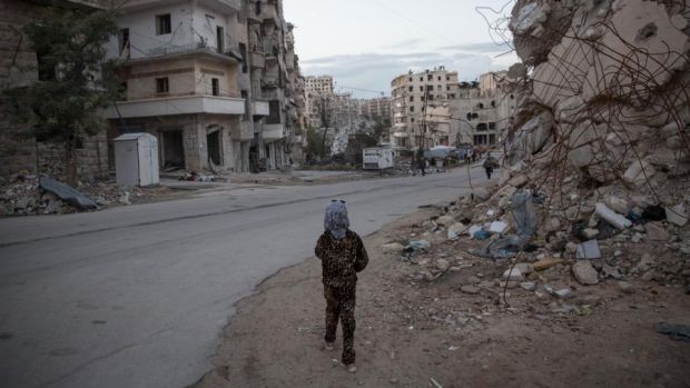 A young girl walks around her neighbourhood in the Syrian city of Aleppo. Her family returned in August after four years in a camp for displaced people. They still have no water or electricity. Photograph: Sally Hayden