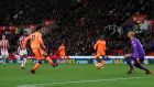 Liverpool’s Mohamed Salah scores their third goal in a 3-0 win over Stoke. Photo: Eddie Keogh/Reuters