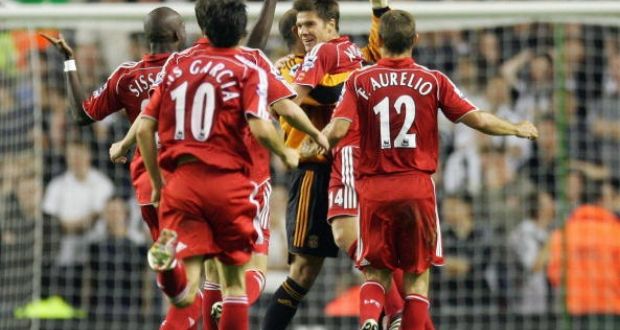 Liverpool’s Xabi Alonso celebrates with his teammates after scoring from inside his own half against Newcastle in 2006. Photograph: Getty Images