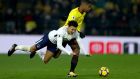 Dele Alli of Tottenham Hotspur and Marvin Zeegelaar of Watford clash during their Premier League meeting at Vicarage Road. Photo: Richard Heathcote/Getty Images
