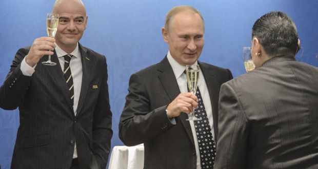 Fifa president Gianni Infantino enjoys a glass of champagne with Russian president Vladimir Putin and Diego Maradona. Photo: Getty Images