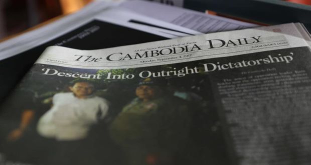 Cambodian media: the final issue of the Cambodia Daily newspaper, with the headline “Descent Into Outright Dictatorship”. Photograph: Satoshi Takahashi/LightRocket via Getty