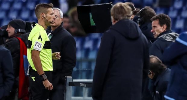  Italian referee Davide Massa looks at the video assistant referee  system during the Italian Serie A soccer match between Lazio and  Fiorentina at the Olympic Stadium in Rome. Photograph: Angelo Carconi/EPA