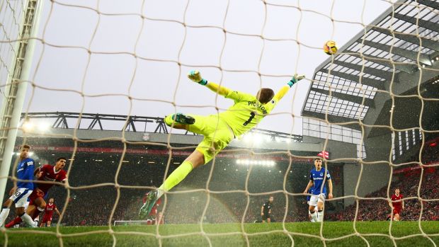Jordan Pickford can’t reach Mohamed Salah’s opener at Anfield. Photograph: Clive Brunskill/Getty