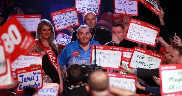 Darts has changed massively  during Phil Taylor’s time in the sport with the atmosphere  during games now  like a big Saturday night out. Photograph: Sean Dempsey/PA Wire